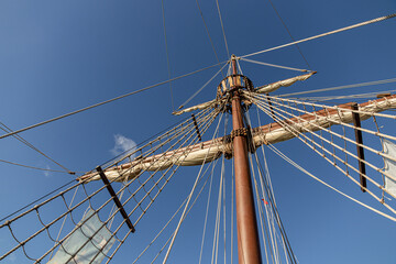 Santander, Spain. Wooden deck and masts with furled sails of the 2017 replica of the nao Santa Maria, flagship of Christopher Columbus 1492 expedition, docked at the port of Calderon