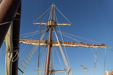 Santander, Spain. Wooden deck and masts with furled sails of the 2017 replica of the nao Santa Maria, flagship of Christopher Columbus 1492 expedition, docked at the port of Calderon