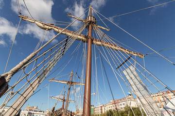 Santander, Spain. Wooden deck and masts with furled sails of the 2017 replica of the nao Santa Maria, flagship of Christopher Columbus 1492 expedition, docked at the port of Calderon