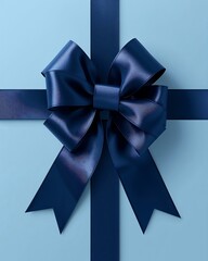 A striking realistic design of a navy blue gift box with a shiny satin bow on a soft blue background
