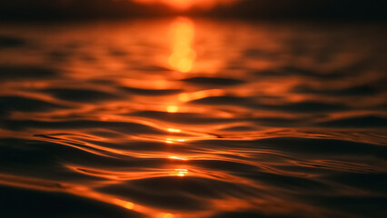 The sun's radiant kiss upon the water, transforming the waves into liquid gold, reflecting the sky. A tranquil scene of nature's artistic expression.