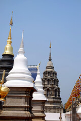 Fototapeta premium Ancient white and black pagoda symbols of buddhism at Wat Den Sali Si Mueang Kaen temple. in Chiang Mai Province in Thailand