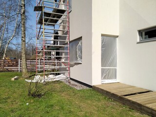 Repair of the facade of a private house, washing and painting the walls