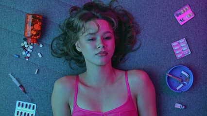 Vicious woman with drugs, cigarettes and pills
