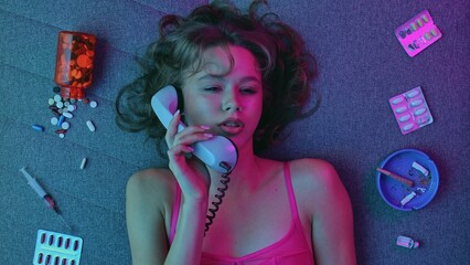 Vicious woman with drugs, cigarettes and pills