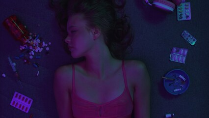 Vicious woman with drugs, cigarettes and pills