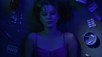Vicious woman with drugs, cigarettes and pills