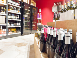 defocused alcohol (wine, champagne, liquor, whiskey) on store shelves