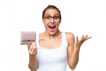 Young caucasian woman holding a wallet over isolated background with shocked facial expression