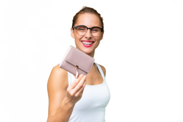 Young caucasian woman holding a wallet over isolated background with happy expression