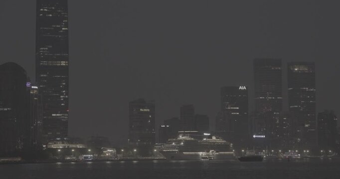 Nighttime Serenity with a Cruise Ship Docked in Shanghai's Waterfront