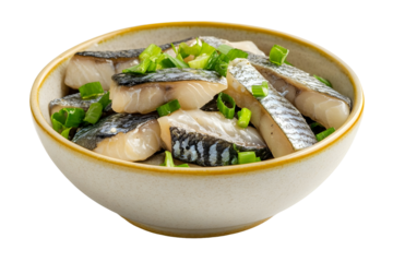 Delicious marinated herring pieces with fresh green onions in ceramic bowl