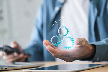 workflow process automation and business process mapping concept , Businessman using laptop with implementation to improve productivity and efficiency Management and organization.