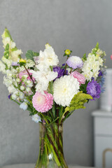 Elegant vase arrangement of colorful blooms with white, pink, and purple flowers. Teacher's Day in Uzbekistan