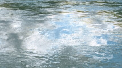 Gentle ripples on tranquil water surface. AI image