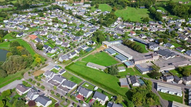 Top-down drone perspective view of center of Saint-Pierre-la-Cour commune with homes, Mayenne, France.