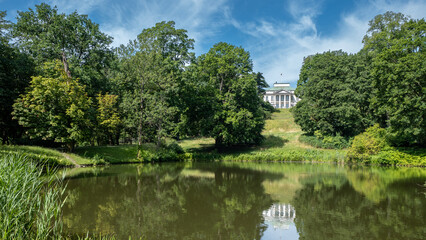 The Royal Lazienki Park in Warsaw in Warsaw. View toward Belweder Palace. Park pond in the foreground. Summer