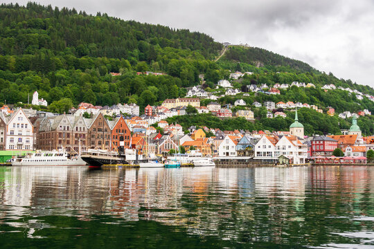 Bergen Bryggen waterfront with traditional buildings reflecting in the V&aring;gen harbor