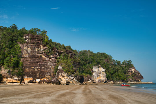 Beach Telok Paku with rocks in Bako National Park, located in Sarawak, on the island of Borneo, Malaysia. It is the oldest national park in Sarawak and has landscapes that are unique in Southeast asia