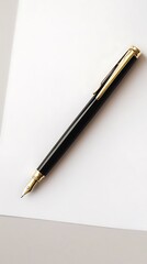 Naklejka premium Elegant black and gold pen isolated on white background