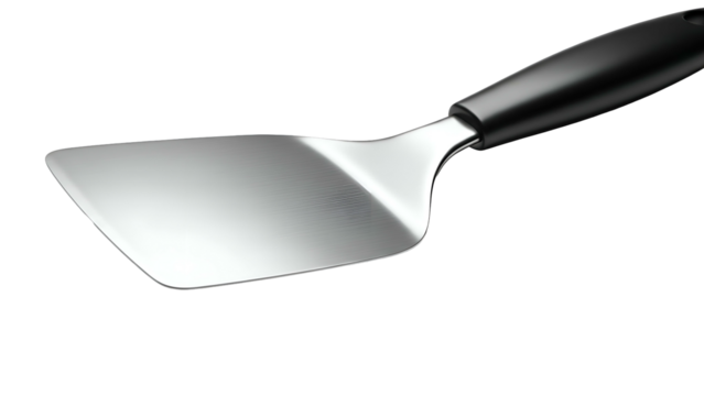 Silver spatula with black handle lying diagonally on dark surface