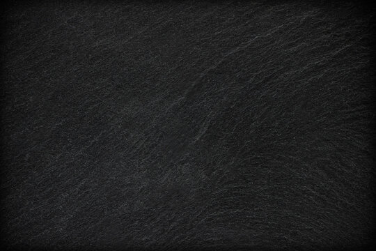 Dark grey black slate background or texture.