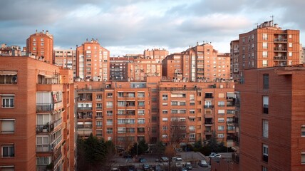 Urban cityscape with sunlit brick buildings. AI image