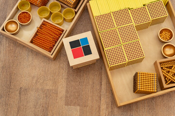 Montessori education. Wooden boxes with materials for alternative learning of mathematics, algebra, geometry, arithmetic in elementary school. Development of fine motor skills and logical thinking.