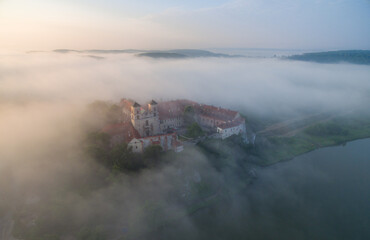 Aerial view of Tyniec abbey in the morning mists, beautiful sunrise, Krakow, Poland
