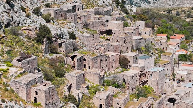 Aerial of Ghost town Anavatos with ruined buildings on cliff on Chios island, Greece