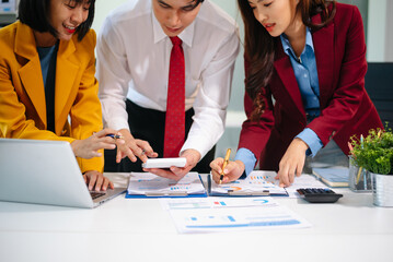 Business team collaboration discussing working analyzing with financial data and marketing growth report graph in team, presentation and digital tablet, laptop.