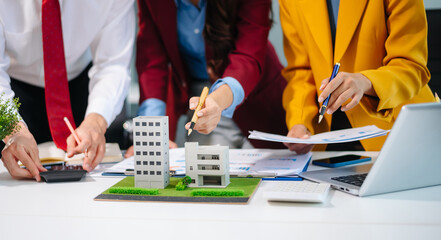 Professionals for a greener future. Showcasing renewable energy solutions with solar panels, wind turbines, and a model house.