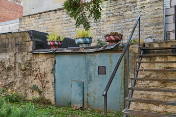 A beautifully designed Urban Staircase adorned with Decorative Planters located above a Cellar Door