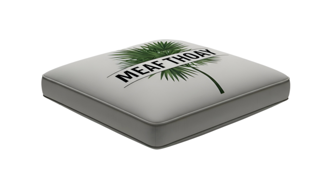 Square, light grey cushion with an illegible tropical design