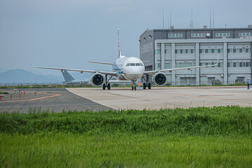 Yonago Airport with mountain backdrop