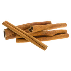 Pile of dried cinnamon sticks on a transparent background. 