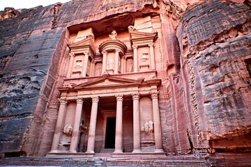 Fototapeta premium Carved sandstone facade of a classical temple set within a rock face