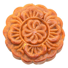 Intricately designed golden brown mooncake with floral pattern. 
