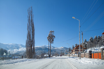 Bakuriani, Georgia. 2 Feb. 2014. Snow slope with ski tracks and trees