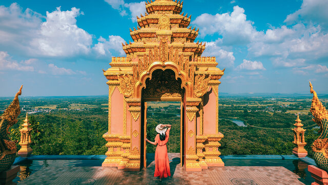 Happy traveler asian woman with dress sightseeing in Wat Phra That Doi Phra Chan temple Lampang Thailand Traditional travel holiday vacation concept