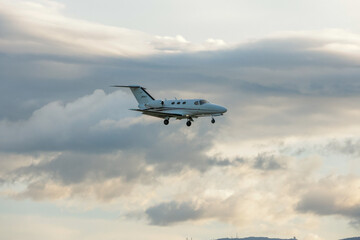 Airplane Landing at Fukuoka Airport During Sunset