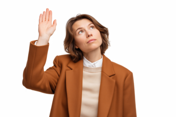 Woman Raising Hand: A woman, dressed in a brown suit and knit, raises her hand and looks up, expressing a gesture of asking a question or offering an idea. 