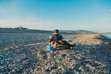 Man Sitting Before Starting To Fish 