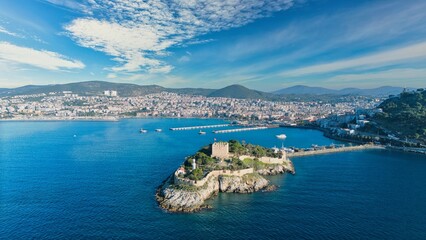 Aerial View of Pigeon Island (Güvercinada) in Kusadasi, Turkey – Historic Fortress Surrounded by the Aegean Sea under Light Clouds