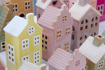 Toy souvenir houses made of porcelain, plastic, or gingerbread depict the streets of an old European city