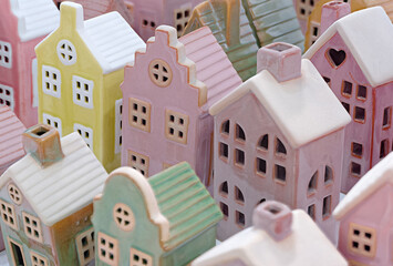 Toy souvenir houses made of porcelain, plastic, or gingerbread depict the streets of an old European city