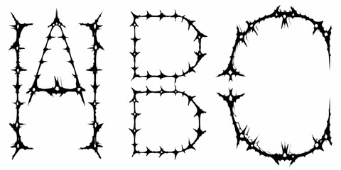 Gothic alphabet letters a b c formed from sharp thorny spikes and barbed wire on white background