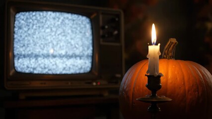 Creepy Halloween scene featuring an old television with static noise and a pumpkin illuminated by a flickering candle flame in a dark room - Powered by Adobe