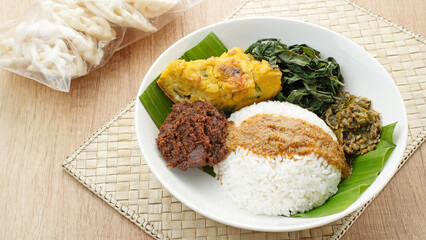 Nasi Padang or Nasi Kapau, rice with various side dishes rendang, egg, and sambal. Indonesian Food