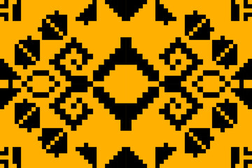 Seamless pixel art tribal pattern with bold black motifs on orange background, ideal for digital textiles, retro fashion, and ethnic-inspired designs.